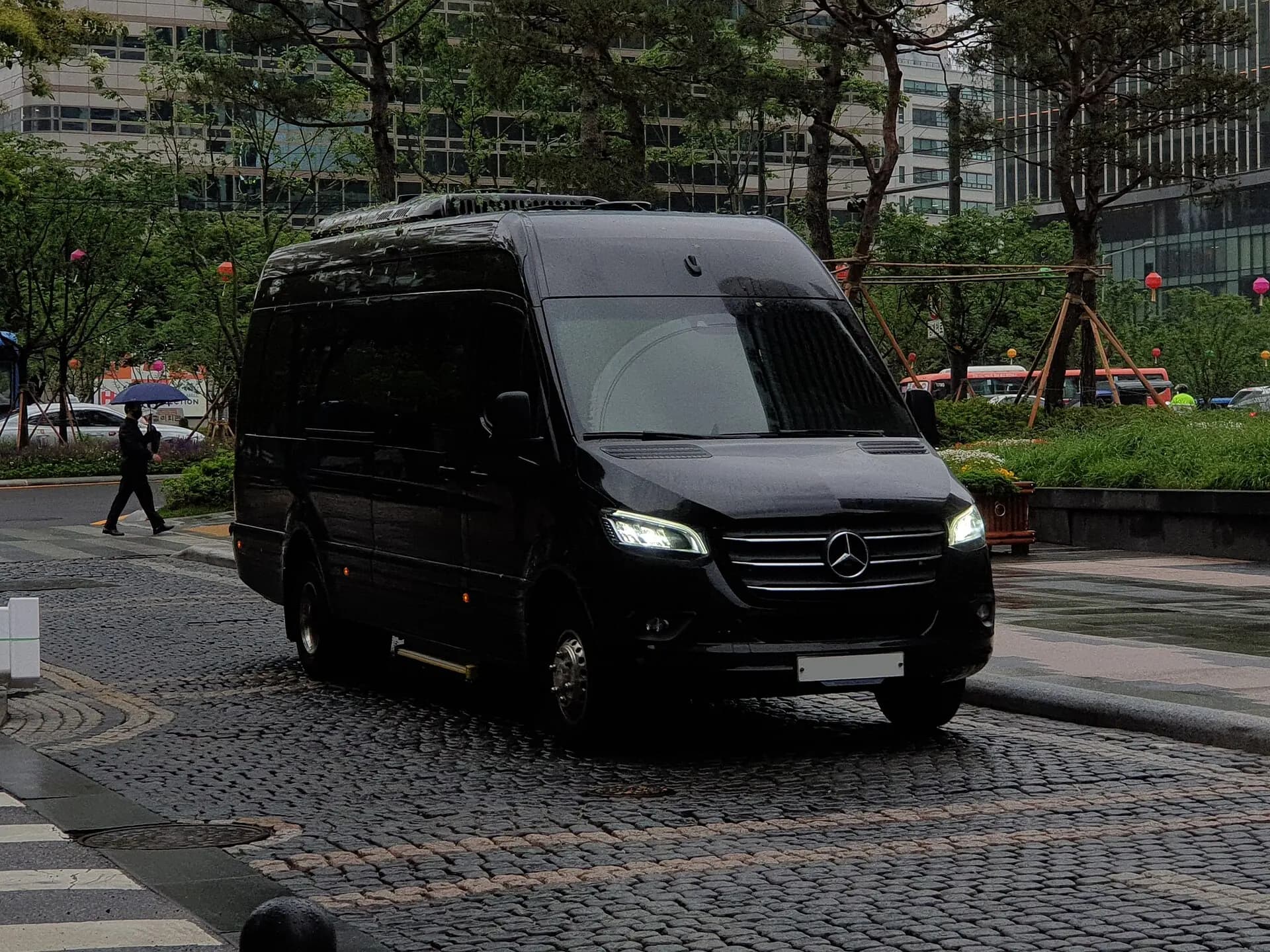 Black Mercedes-Benz high-roof Passenger Sprinter prepared for group transportation.