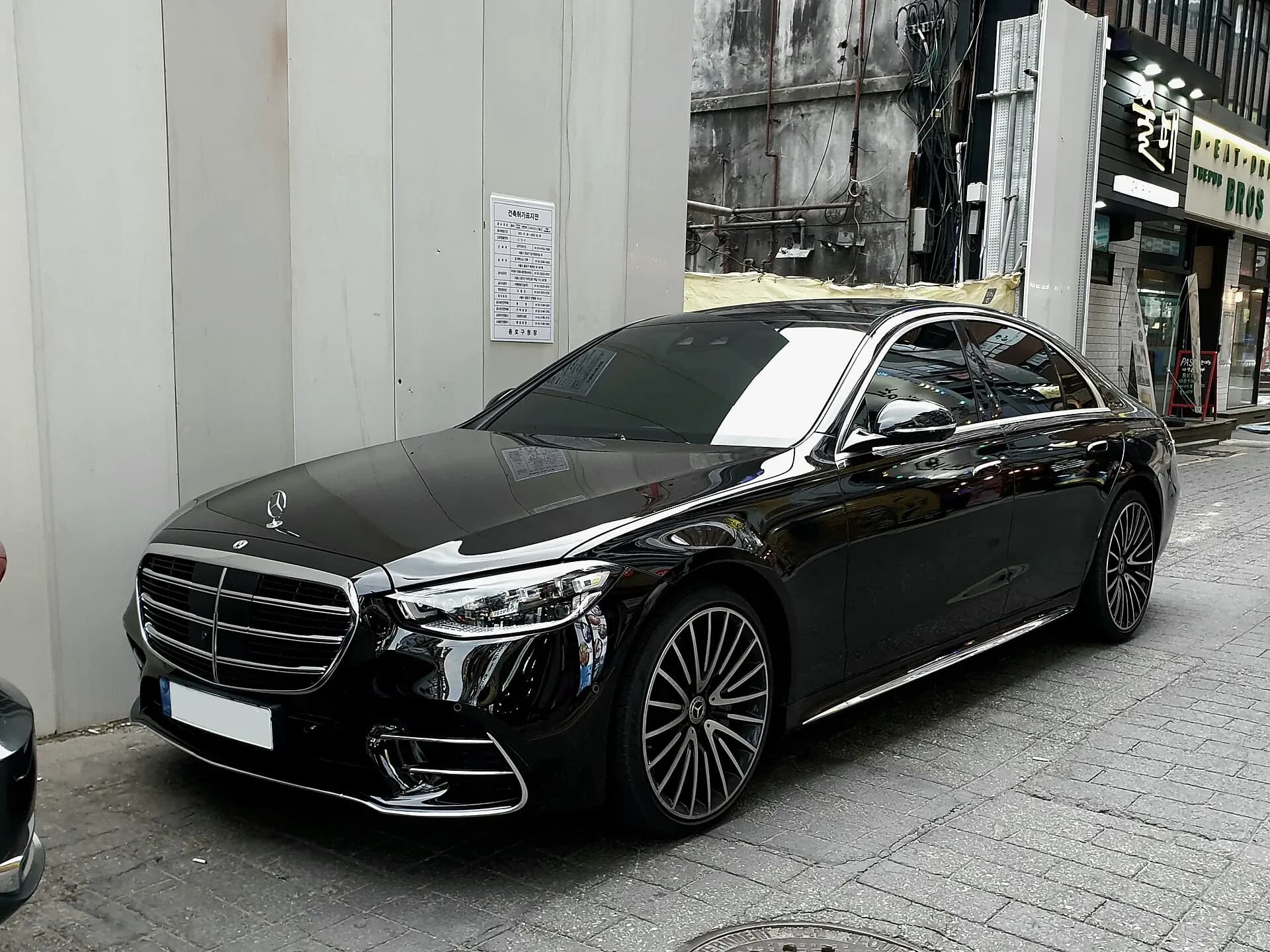 Black Mercedes-Benz S-Class executive sedan.