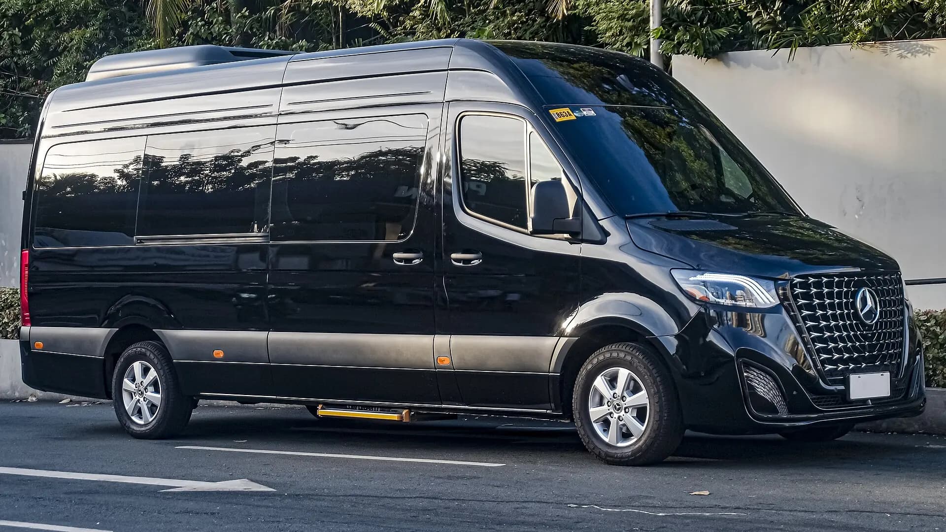 Black Mercedes-Benz Sprinter converted for premium executive passenger service.